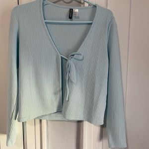 Blue ribbed cardigan. The size is medium. The product is from H&M